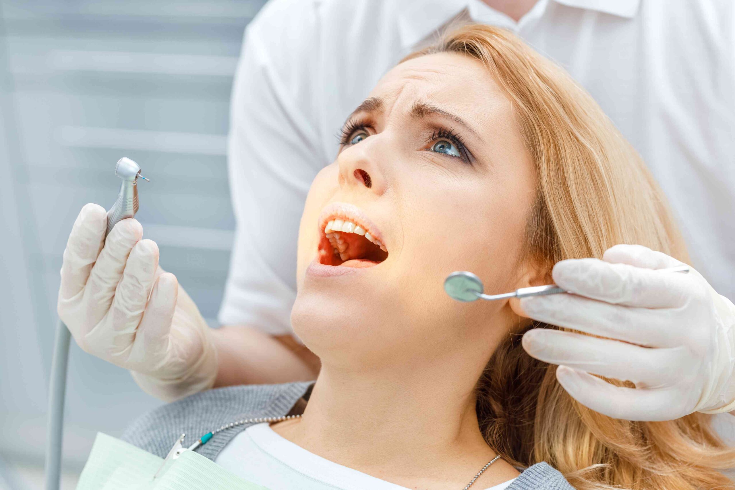 Nervous patient receiving reassurance before dental treatment.